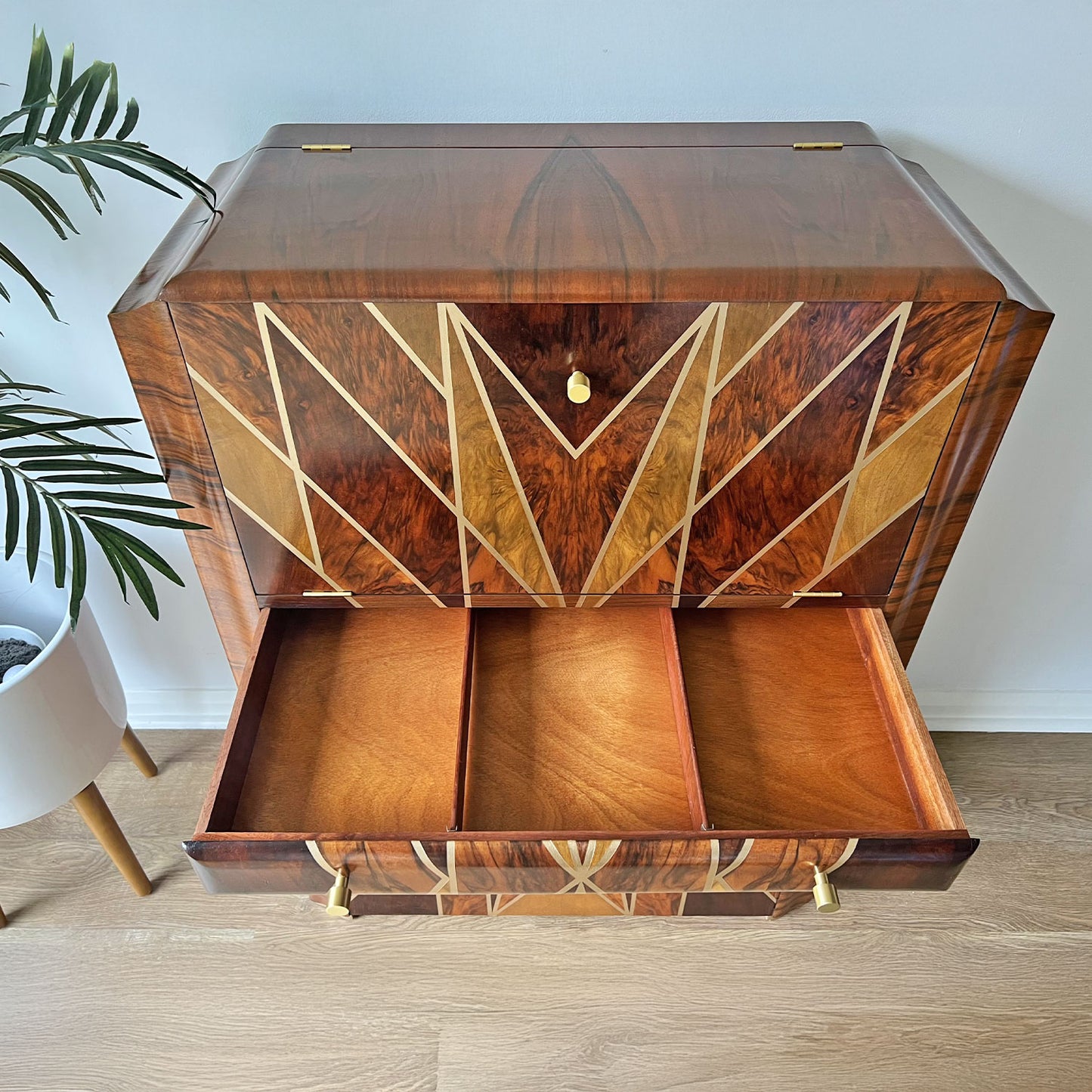 Open cabinet showcasing interior storage – Professionally restored Art Deco drinks cabinet featuring drawer storage.