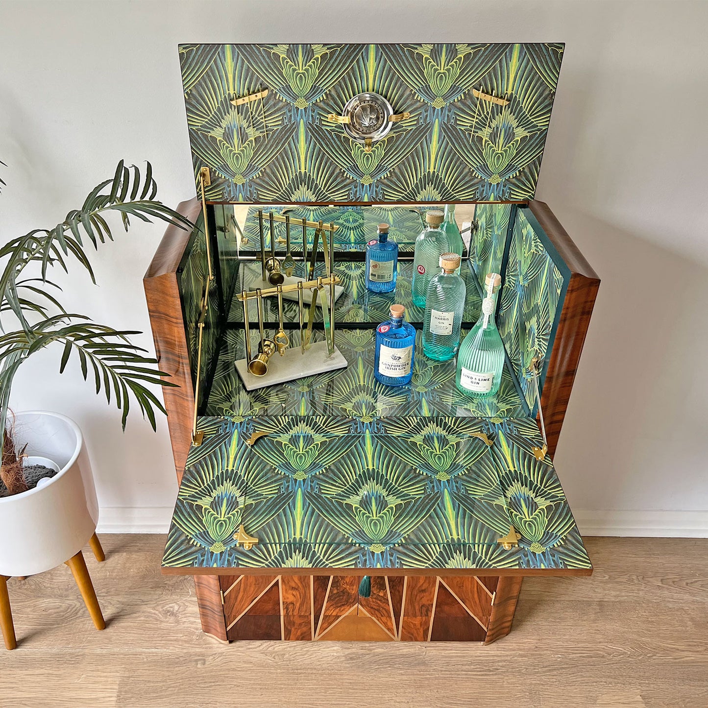 Open cabinet showcasing interior storage – Professionally restored Art Deco drinks cabinet featuring a mirrored cocktail prep area, glassware storage, and a lockable cupboard.