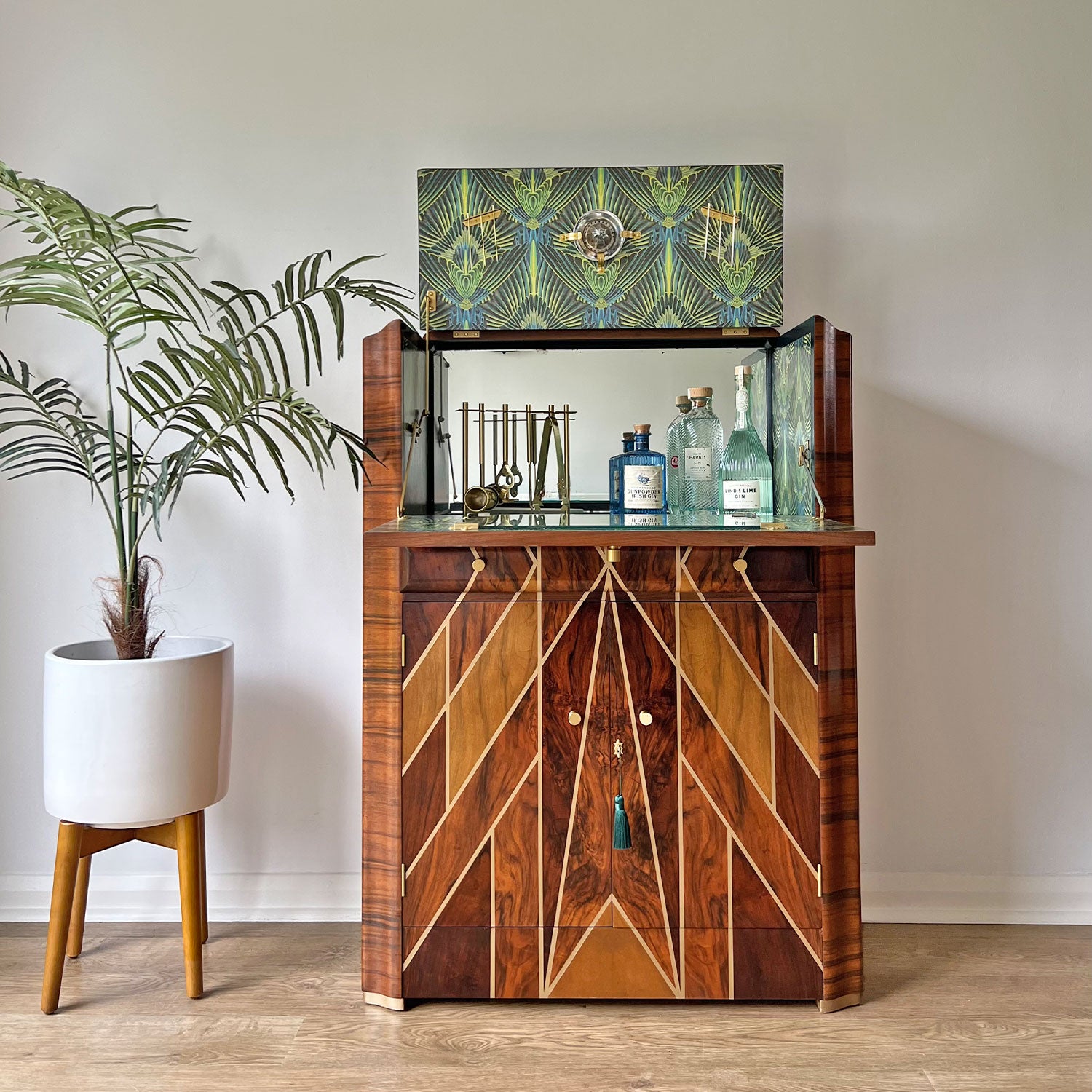 Open cabinet showcasing interior storage – Professionally restored Art Deco drinks cabinet featuring a mirrored cocktail prep area, glassware storage.