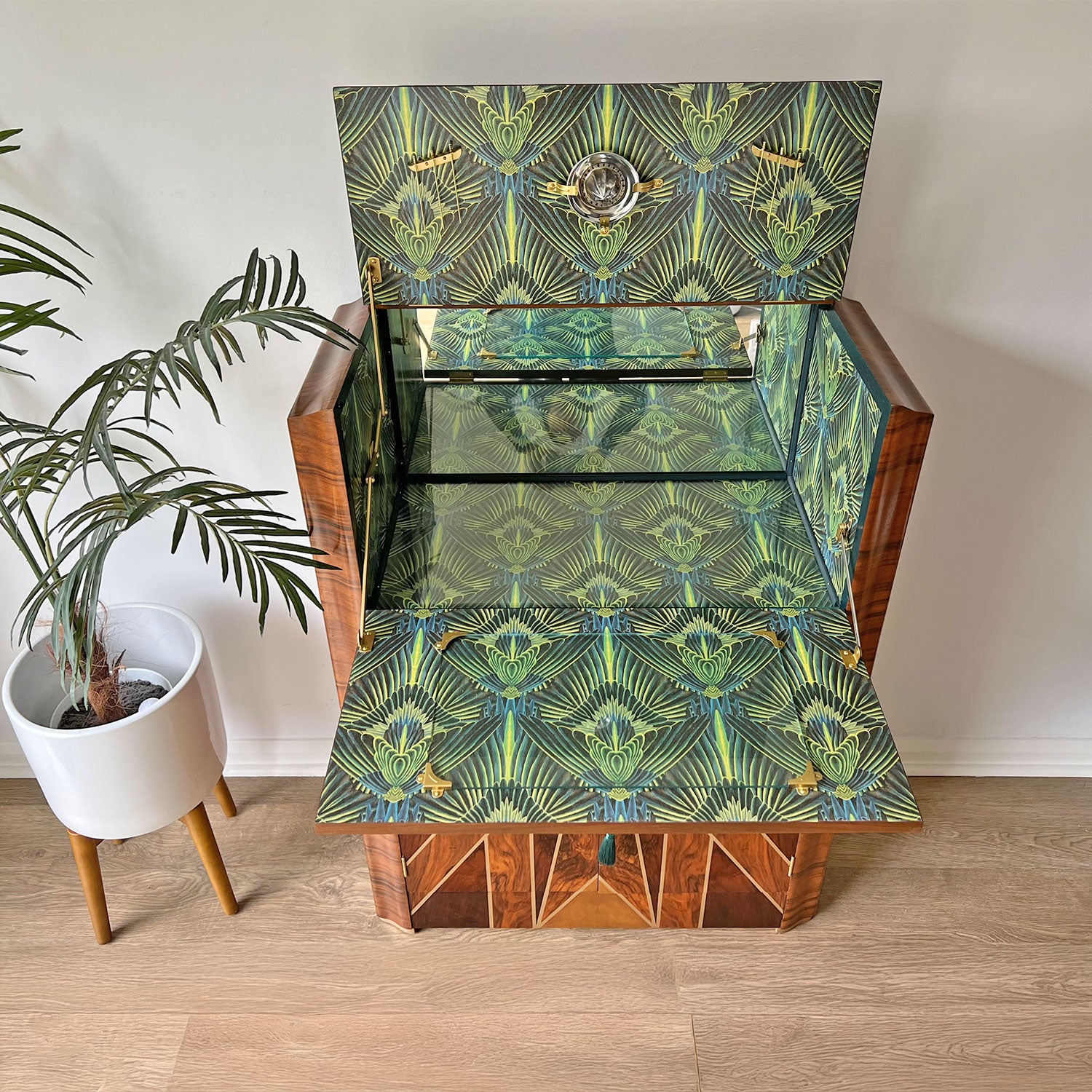 Interior featuring Divine Savages 'Gershwing' wallpaper – Opulent green and blue feathered Art Deco print decoupaged inside, sealed with protective varnish.